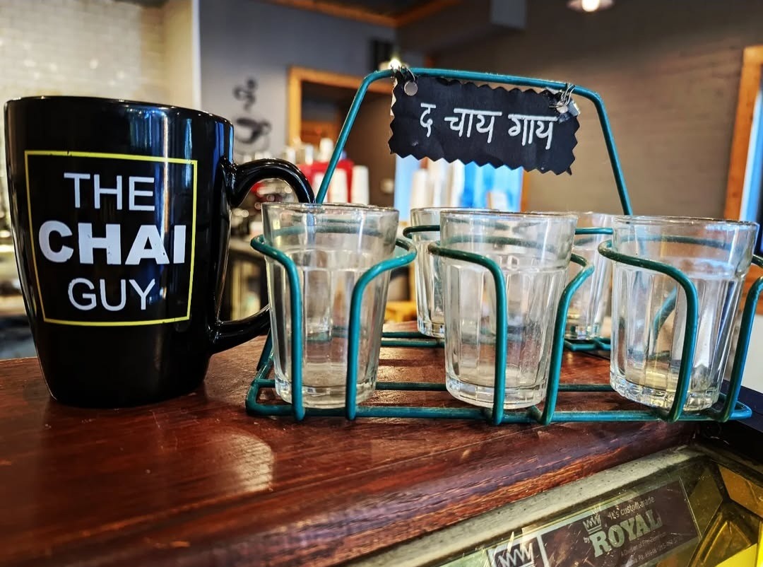The Chai Guy mug with traditional chai glasses